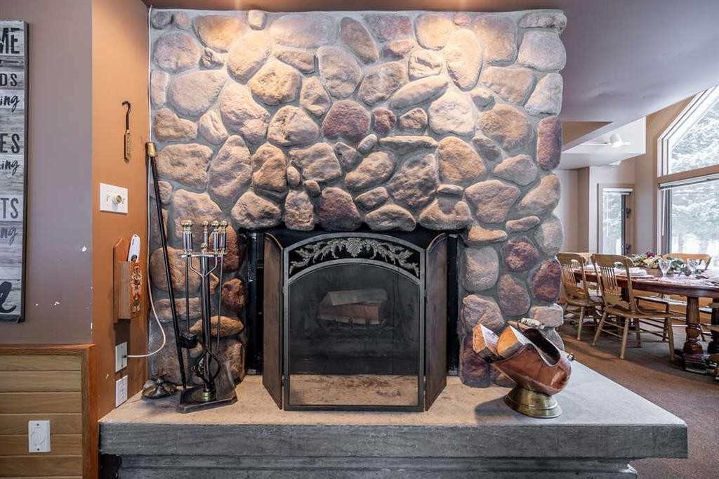 107 Mount View, Waterton Park, AB - Indoor With Fireplace