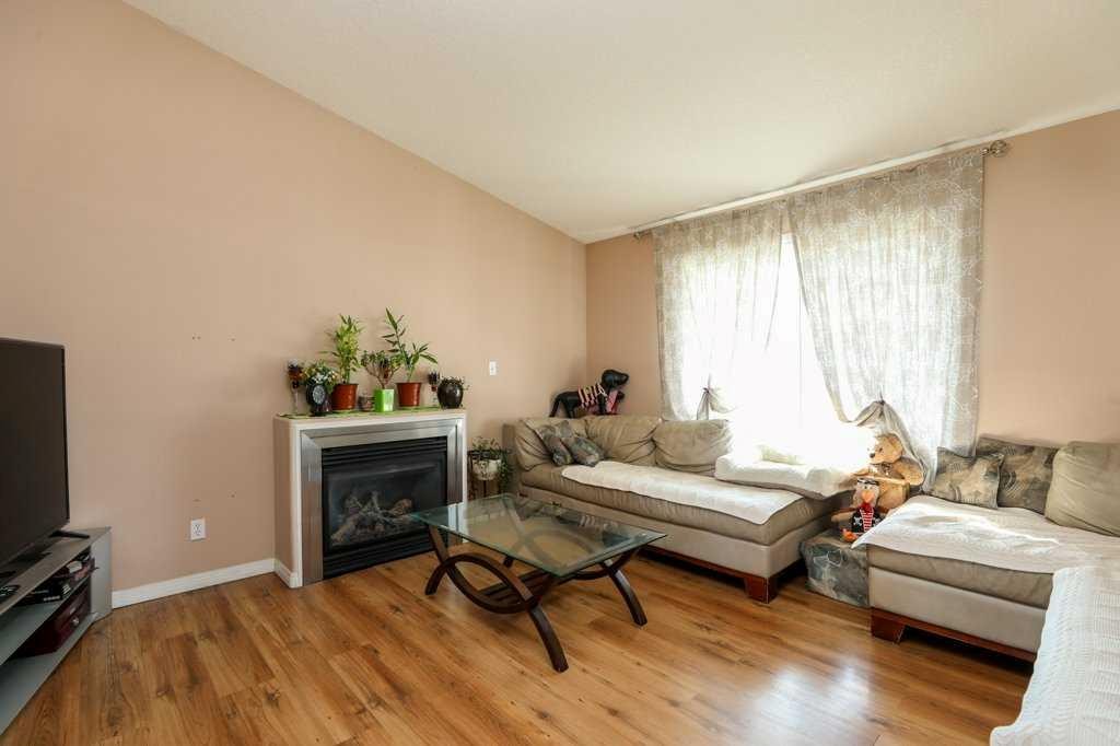 117 21 Street, Fort Macleod, AB - Indoor Photo Showing Living Room With Fireplace