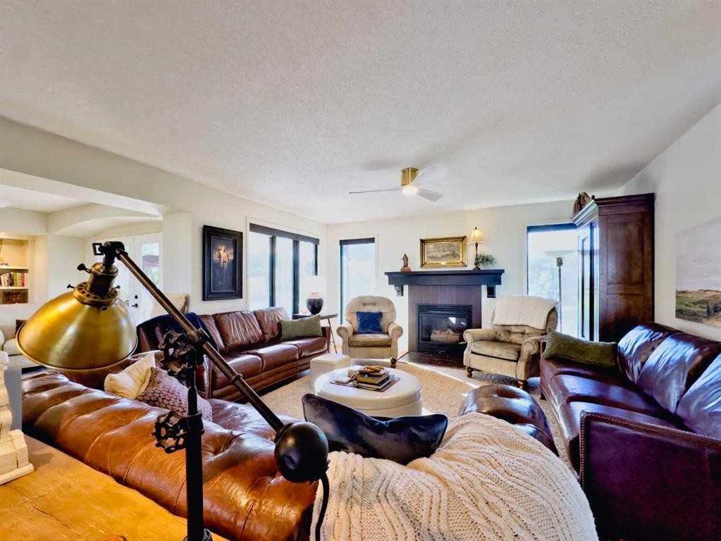 42082 Range Road 274, Hill Spring, AB - Indoor Photo Showing Living Room With Fireplace