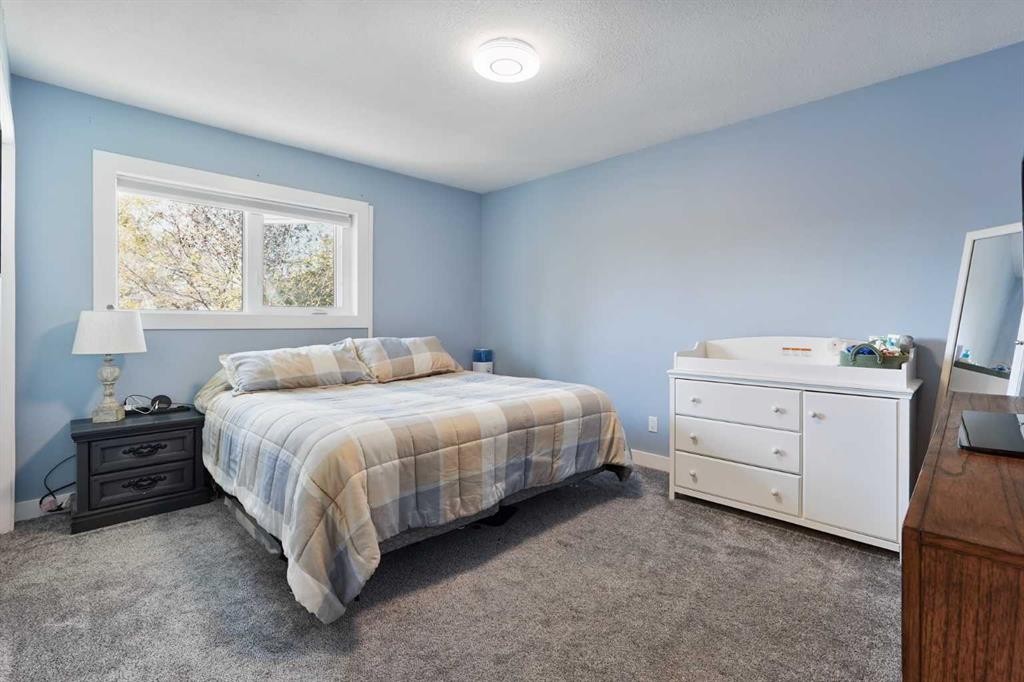 486N 100E, Raymond, AB - Indoor Photo Showing Bedroom