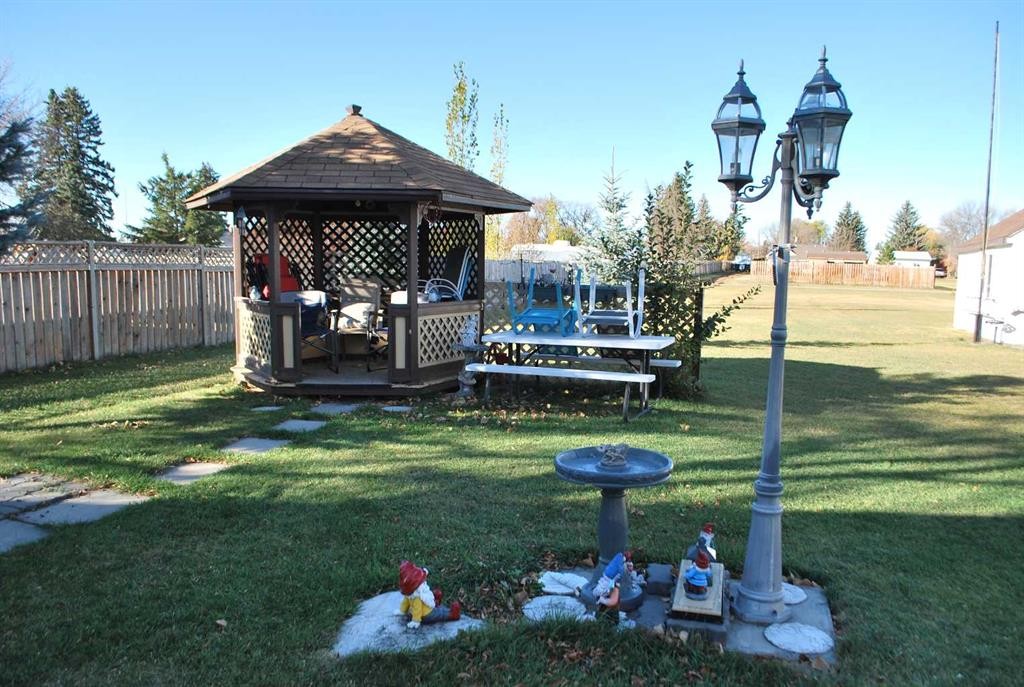 246 N 100 E, Raymond, AB - Outdoor With Backyard