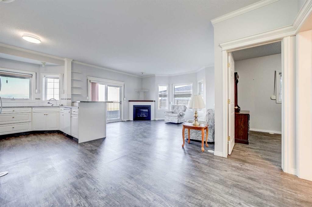 103-6 Skyline Crescent, Claresholm, AB - Indoor Photo Showing Other Room With Fireplace