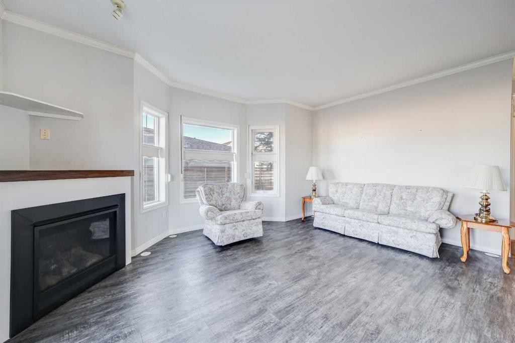 103-6 Skyline Crescent, Claresholm, AB - Indoor Photo Showing Living Room With Fireplace