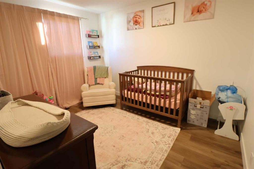 5707 50 St, Taber, AB - Indoor Photo Showing Bedroom
