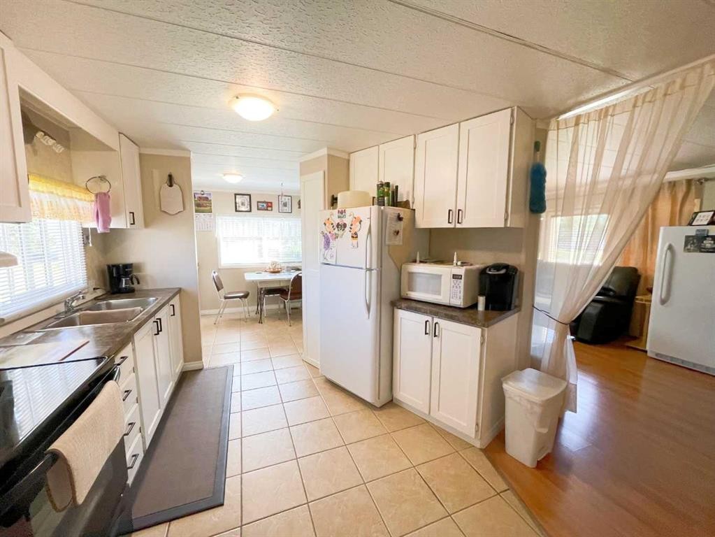 331 Armstrong Street, Carmangay, AB - Indoor Photo Showing Kitchen With Double Sink