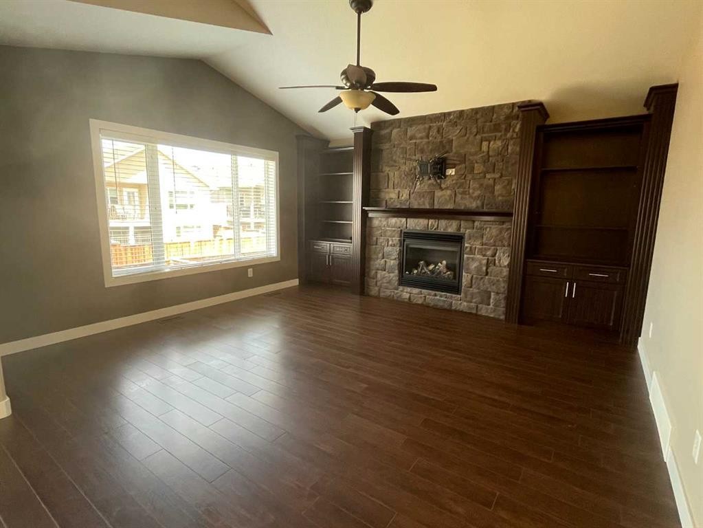 295 Sixmile Ridge South, Lethbridge, AB - Indoor Photo Showing Other Room With Fireplace