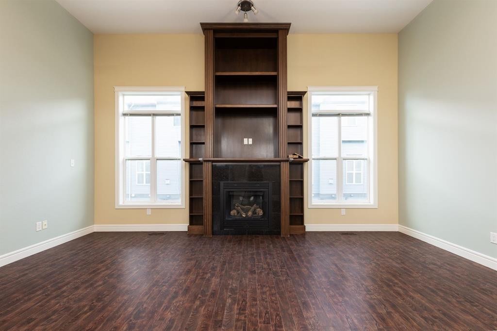 847 Mt Sundance Manor West, Lethbridge, AB - Indoor Photo Showing Other Room With Fireplace
