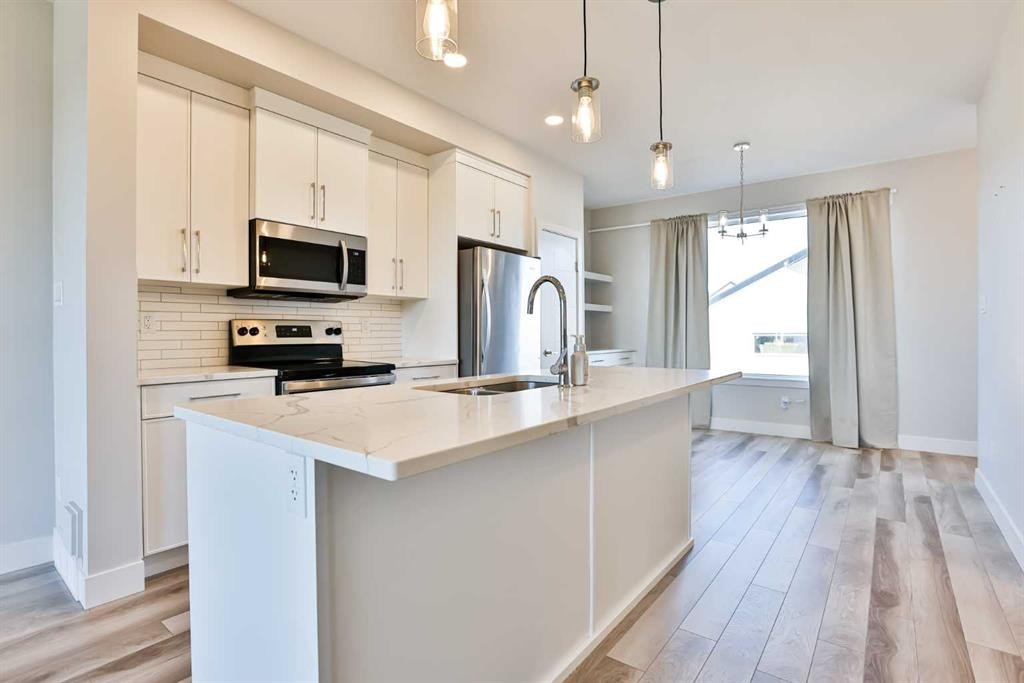 3009 46 Street South, Lethbridge, AB - Indoor Photo Showing Kitchen With Double Sink With Upgraded Kitchen