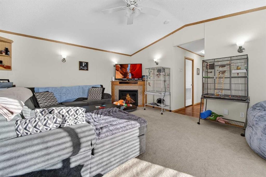 5004 Seasons Boulevard, Coaldale, AB - Indoor Photo Showing Living Room With Fireplace