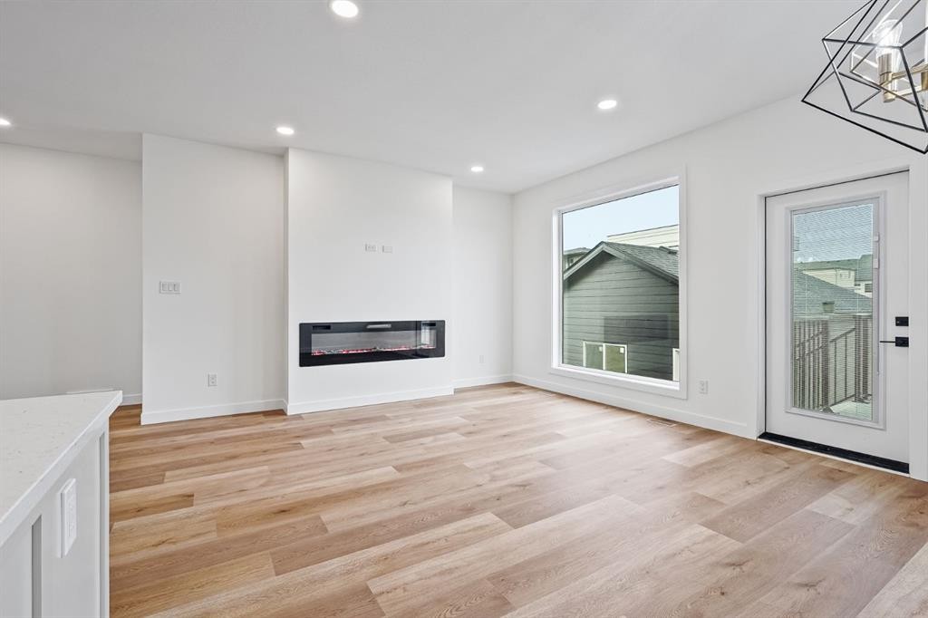 383 Caledonia Boulevard West, Lethbridge, AB - Indoor Photo Showing Other Room With Fireplace