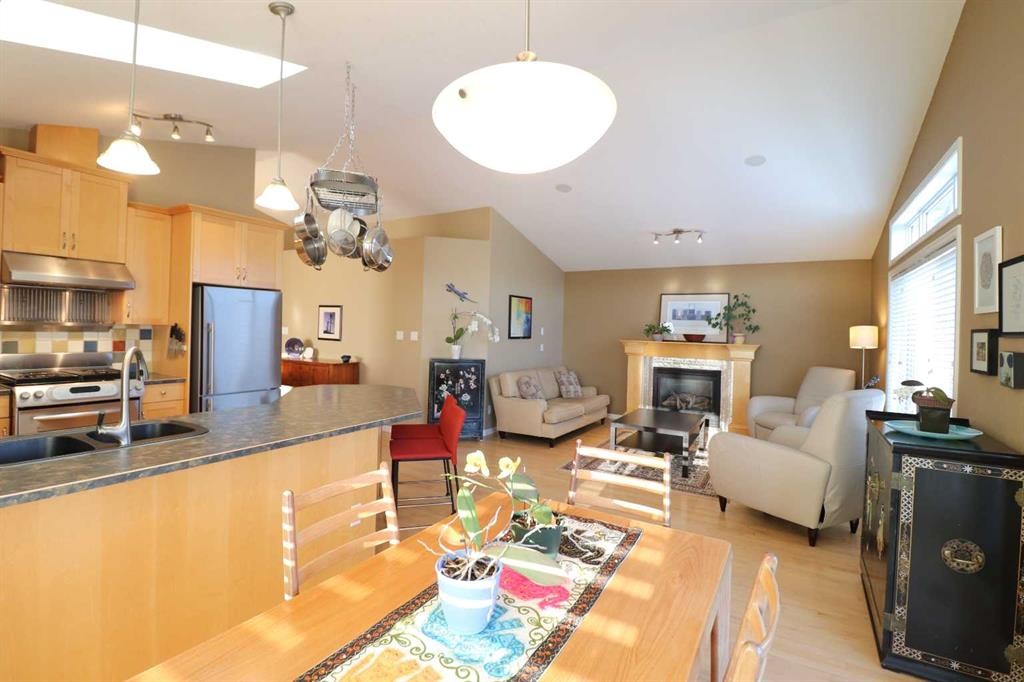 50 Riverbrook Close West, Lethbridge, AB - Indoor Photo Showing Kitchen With Fireplace With Double Sink