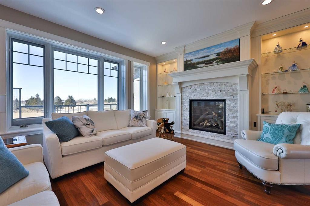 28 Cobblestone Lane, Raymond, AB - Indoor Photo Showing Living Room With Fireplace