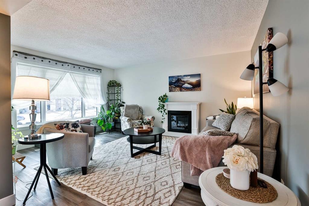 285 Jerry Potts Boulevard West, Lethbridge, AB - Indoor Photo Showing Living Room With Fireplace