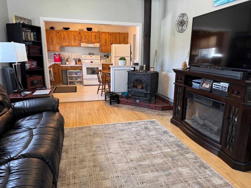 7918 23 Avenue, Coleman, AB - Indoor Photo Showing Living Room With Fireplace