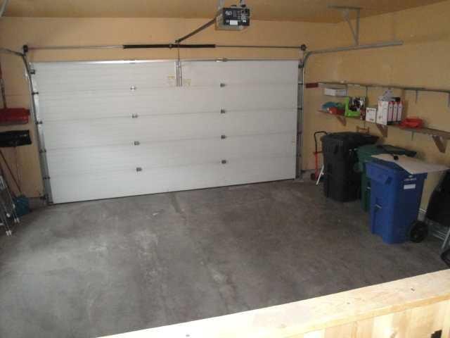 51 Kodiak Boulevard North, Lethbridge, AB - Indoor Photo Showing Garage
