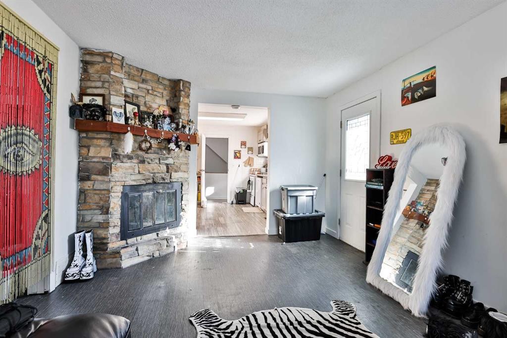 1019 7 Street North, Lethbridge, AB - Indoor Photo Showing Living Room With Fireplace
