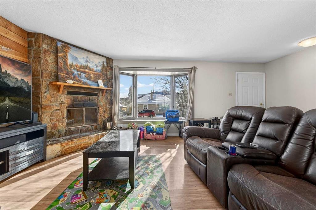 7705 24 Avenue, Coleman, AB - Indoor Photo Showing Living Room With Fireplace