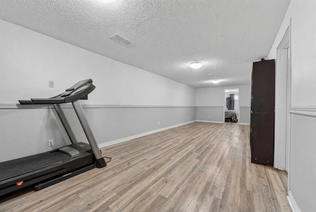 7705 24 Avenue, Coleman, AB - Indoor Photo Showing Gym Room
