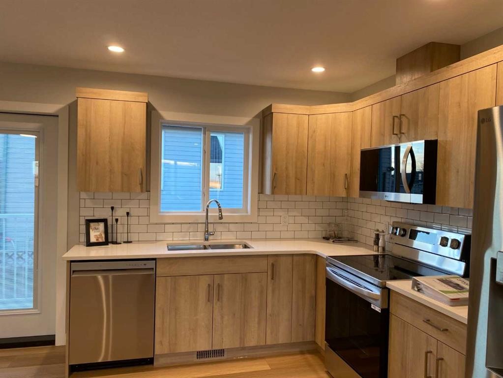 4202 57 Street, Taber, AB - Indoor Photo Showing Kitchen With Stainless Steel Kitchen With Double Sink