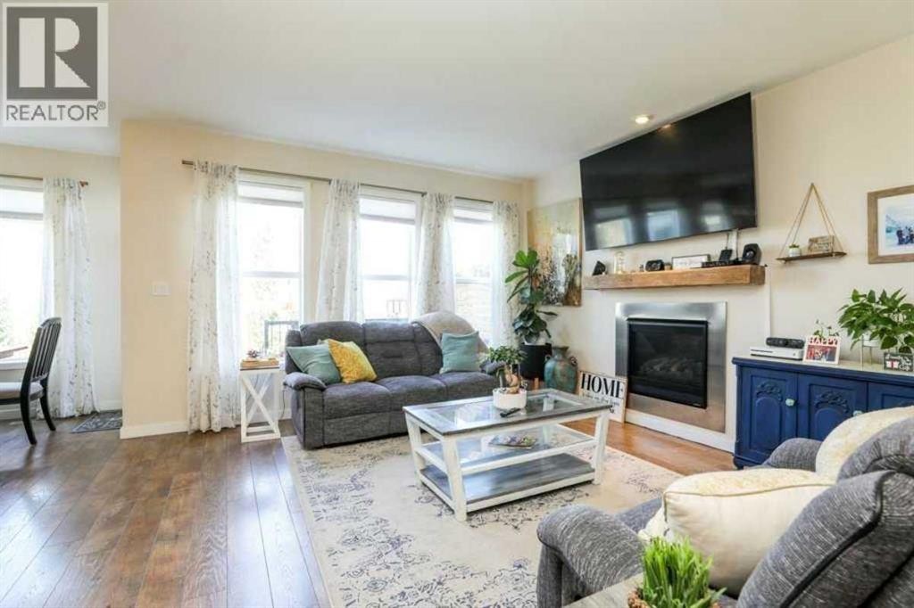 7 Greywolf Road North, Lethbridge, AB - Indoor Photo Showing Living Room With Fireplace