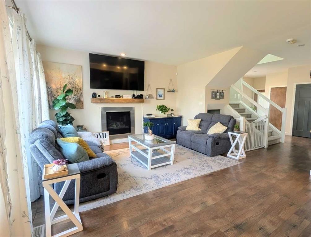 7 Greywolf Road North, Lethbridge, AB - Indoor Photo Showing Living Room With Fireplace