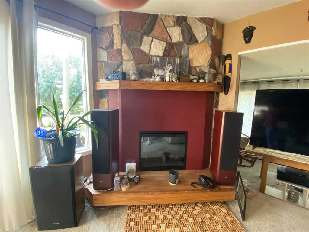 6001 16 Avenue, Coleman, AB - Indoor With Fireplace