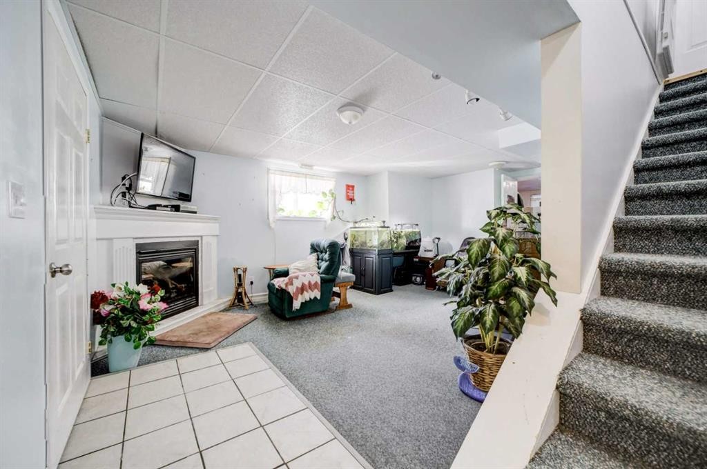 109 Argyle Street, Granum, AB - Indoor Photo Showing Other Room With Fireplace