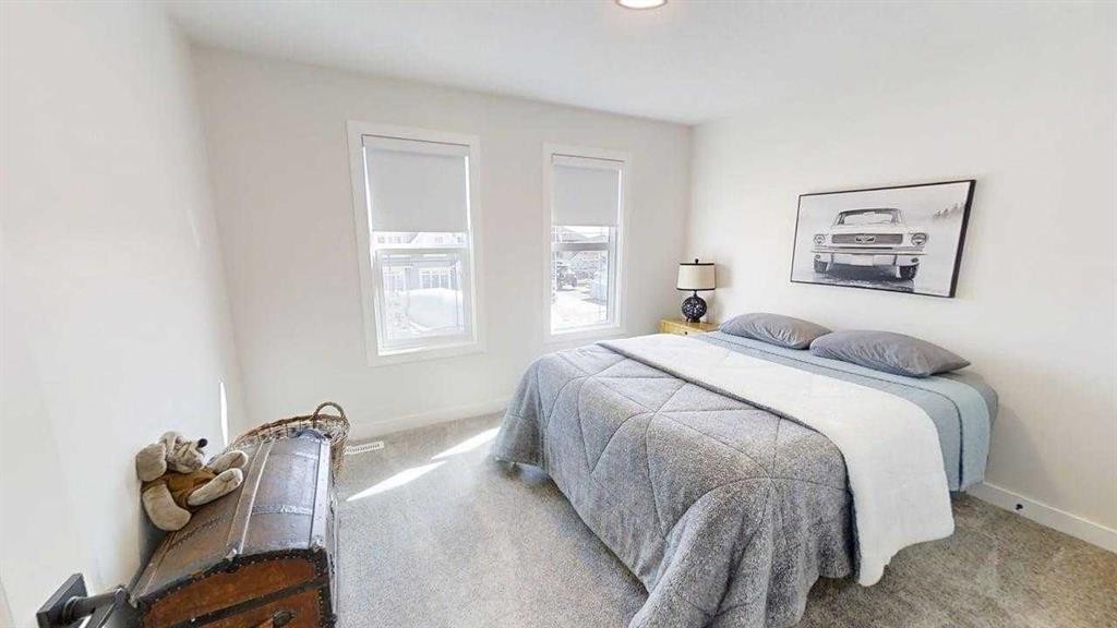 28 Aster Link, Okotoks, AB - Indoor Photo Showing Bedroom