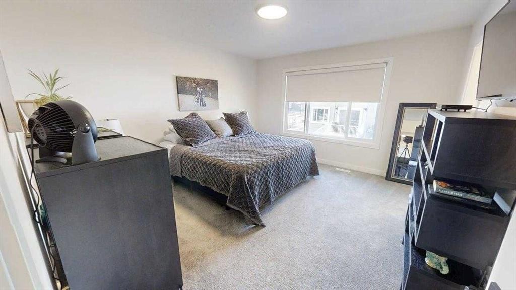 28 Aster Link, Okotoks, AB - Indoor Photo Showing Bedroom