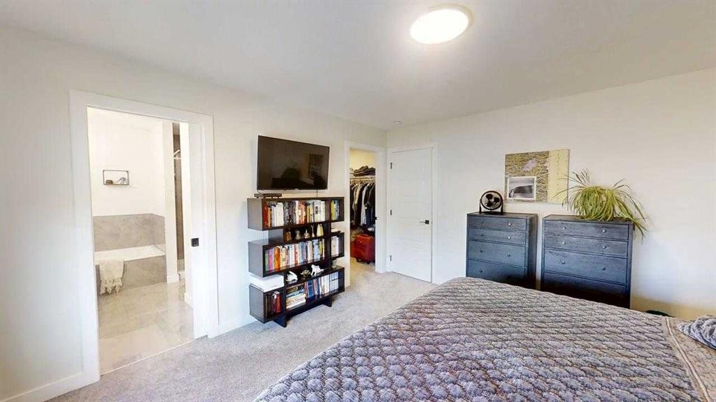 28 Aster Link, Okotoks, AB - Indoor Photo Showing Bedroom