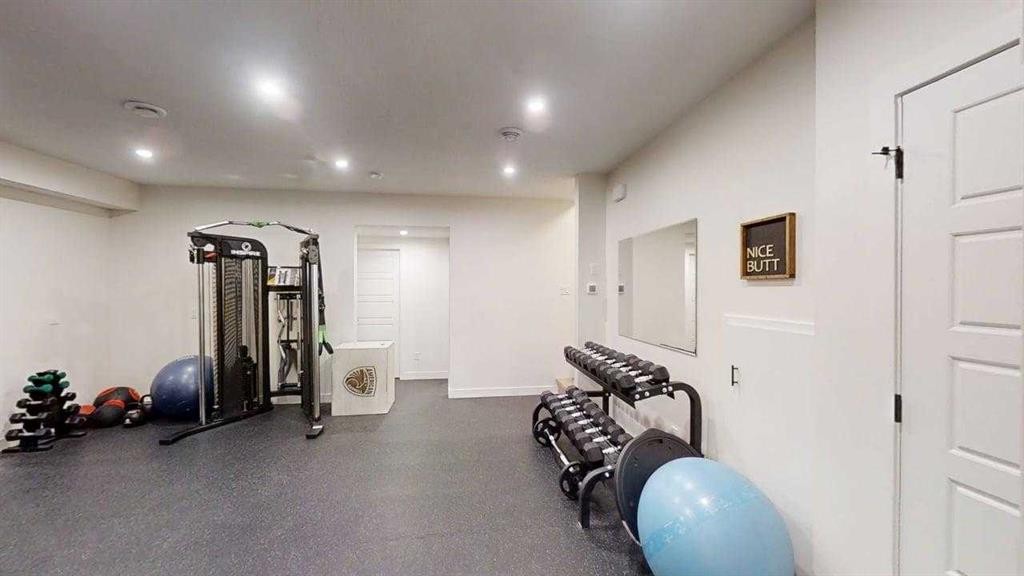 28 Aster Link, Okotoks, AB - Indoor Photo Showing Gym Room