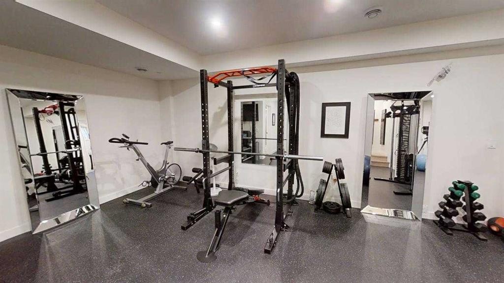 28 Aster Link, Okotoks, AB - Indoor Photo Showing Gym Room