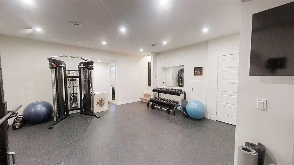 28 Aster Link, Okotoks, AB - Indoor Photo Showing Gym Room