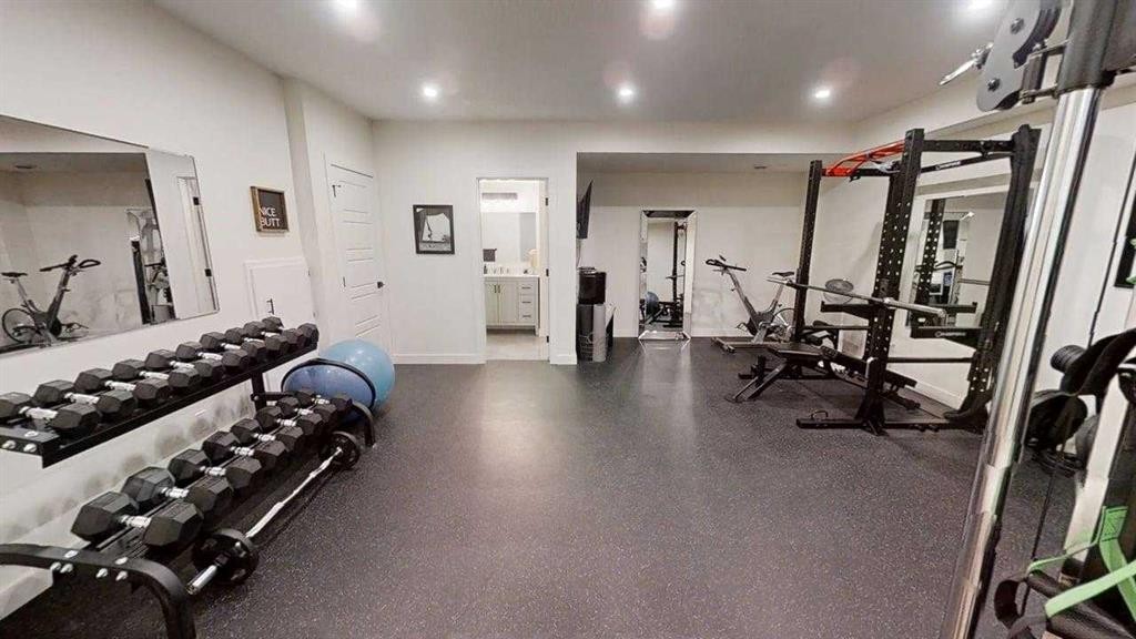 28 Aster Link, Okotoks, AB - Indoor Photo Showing Gym Room