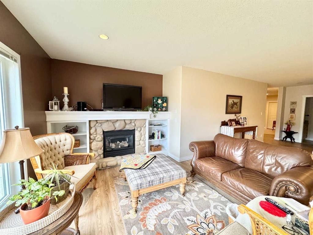 2-373 Canyon Boulevard West, Lethbridge, AB - Indoor Photo Showing Living Room With Fireplace