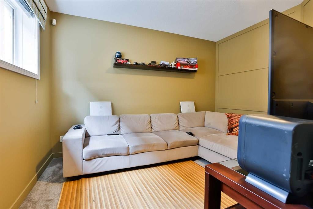 66 Coalbanks Gate West, Lethbridge, AB - Indoor Photo Showing Living Room With Fireplace