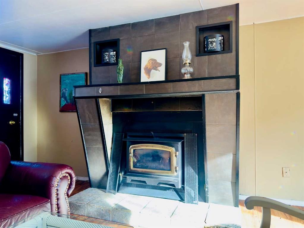 15030 21 Aveunue, Frank, AB - Indoor With Fireplace