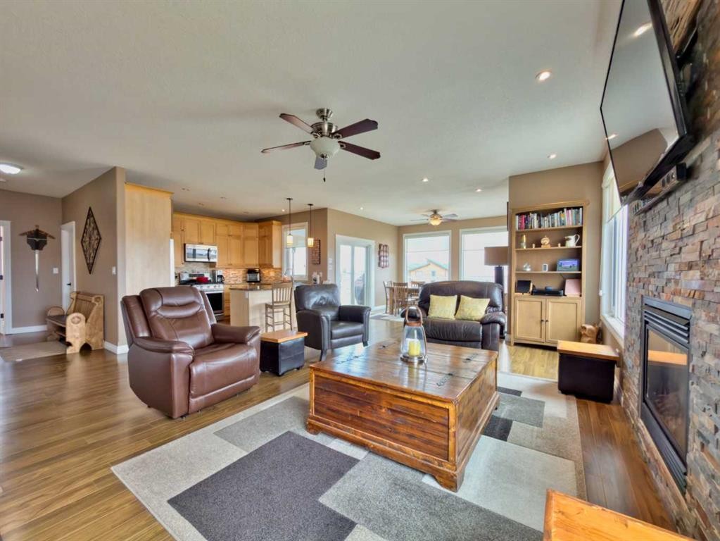 5 Walking Plow Estates, Cowley, AB - Indoor Photo Showing Living Room With Fireplace