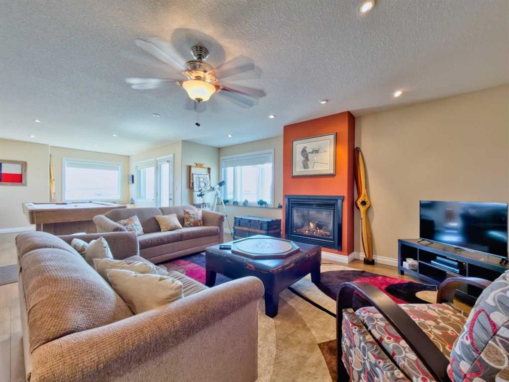 5 Walking Plow Estates, Cowley, AB - Indoor Photo Showing Living Room With Fireplace