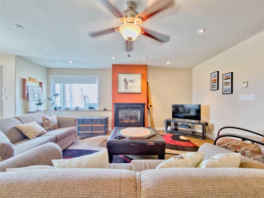 5 Walking Plow Estates, Cowley, AB - Indoor Photo Showing Living Room With Fireplace