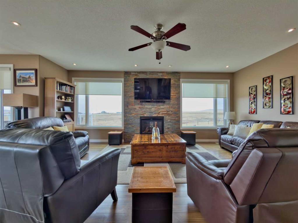 5 Walking Plow Estates, Cowley, AB - Indoor Photo Showing Living Room With Fireplace