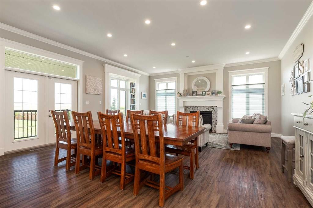 1 Edgemoor Way West, Lethbridge, AB - Indoor Photo Showing Dining Room With Fireplace