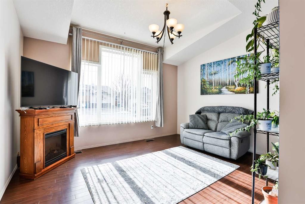 289 Cougar Way North, Lethbridge, AB - Indoor Photo Showing Living Room With Fireplace