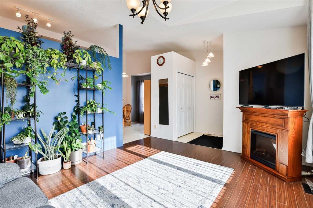 289 Cougar Way North, Lethbridge, AB - Indoor Photo Showing Other Room With Fireplace