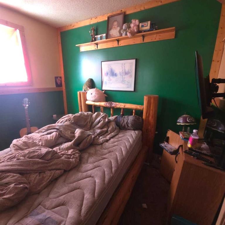 6710 17 Avenue, Coleman, AB - Indoor Photo Showing Bedroom