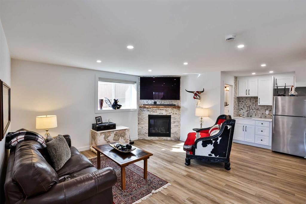 56 Greywolf Road North, Lethbridge, AB - Indoor Photo Showing Living Room With Fireplace