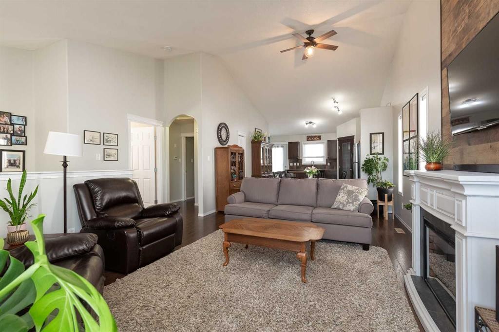 570 Edinburgh Road West, Lethbridge, AB - Indoor Photo Showing Living Room With Fireplace