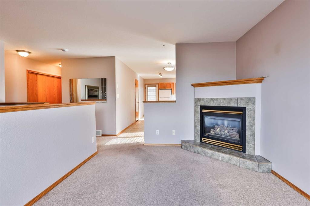 38 St James Crescent North, Lethbridge, AB - Indoor Photo Showing Living Room With Fireplace
