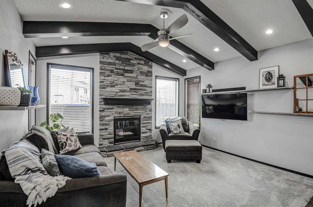 23 Cranberry Circle Se, Calgary, AB - Indoor Photo Showing Living Room With Fireplace