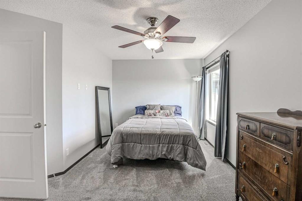 23 Cranberry Circle Se, Calgary, AB - Indoor Photo Showing Bedroom